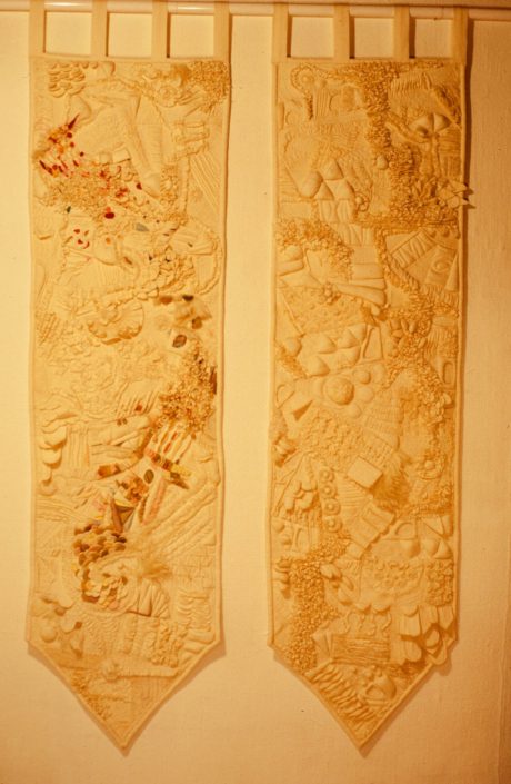 Two wooden boards with a pattern of flowers.