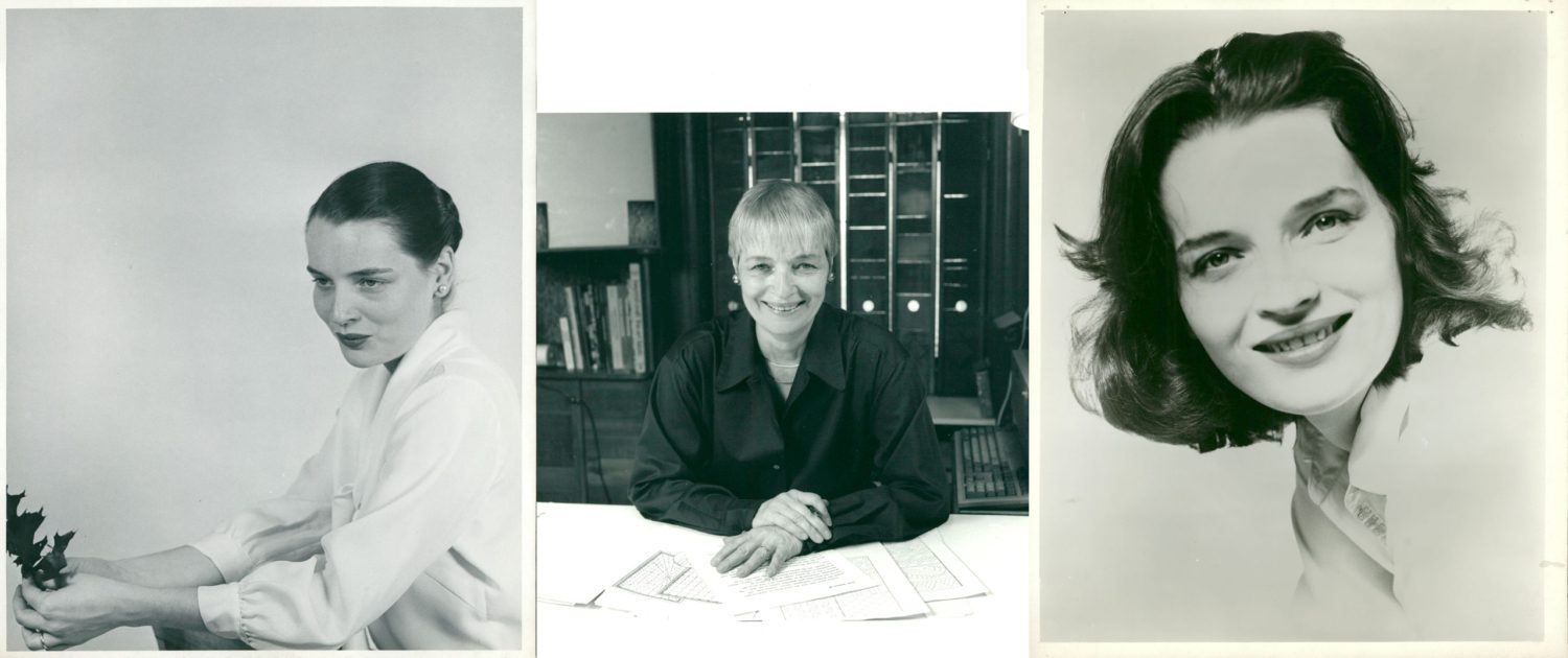 Three women are sitting at a table and smiling.